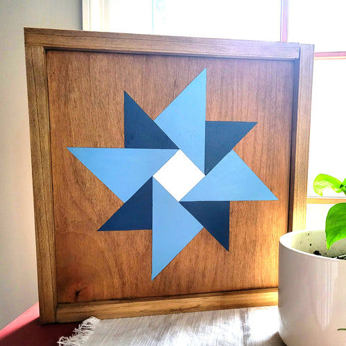 handmade star barn quilt with stain and blue paint